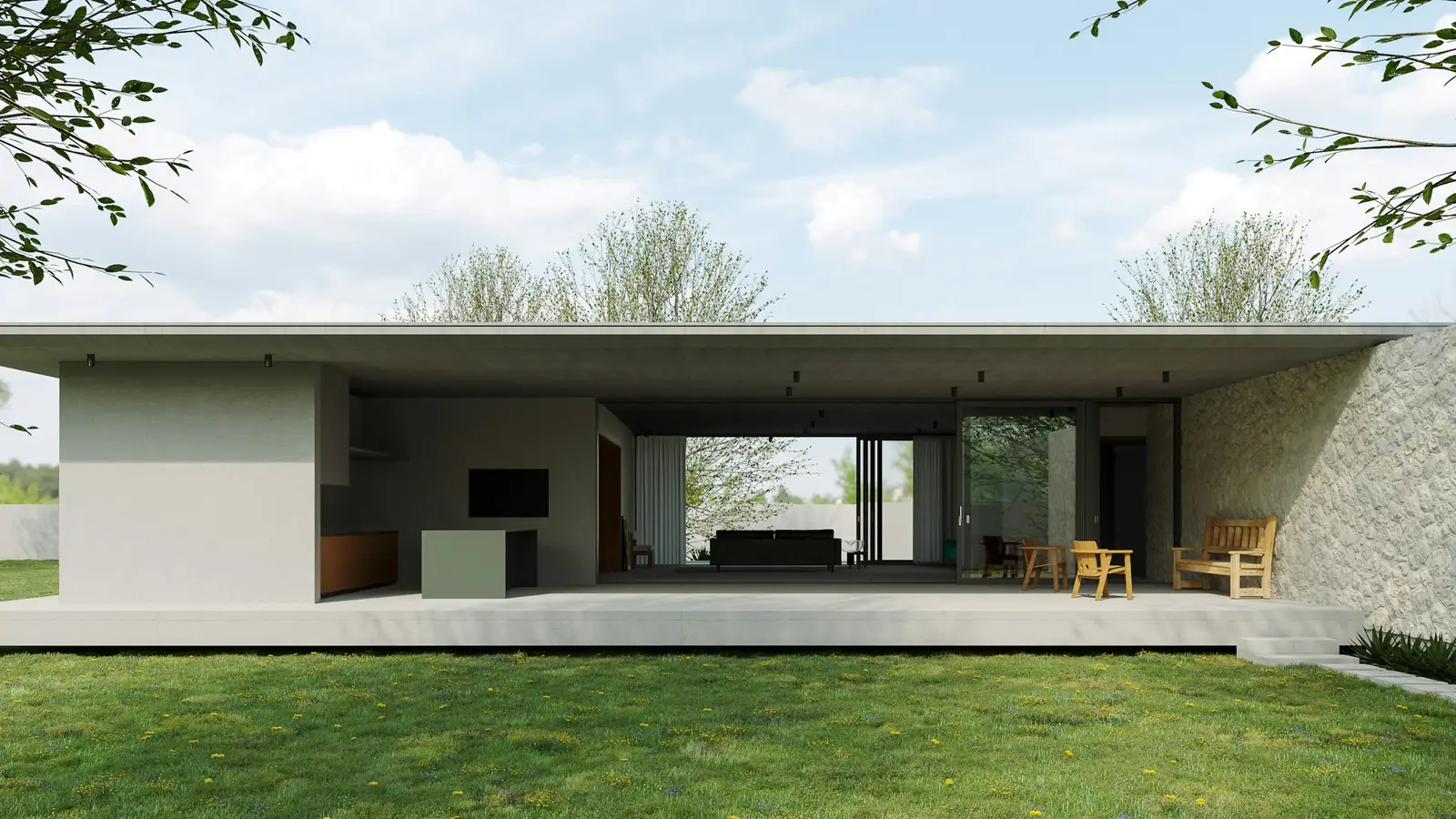 Vivienda unifamiliar de una planta con muro de piedra y amplio jardín de césped
